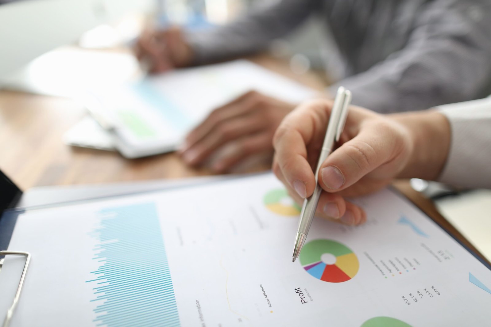 two-businessman-hold-arms-financial-papers